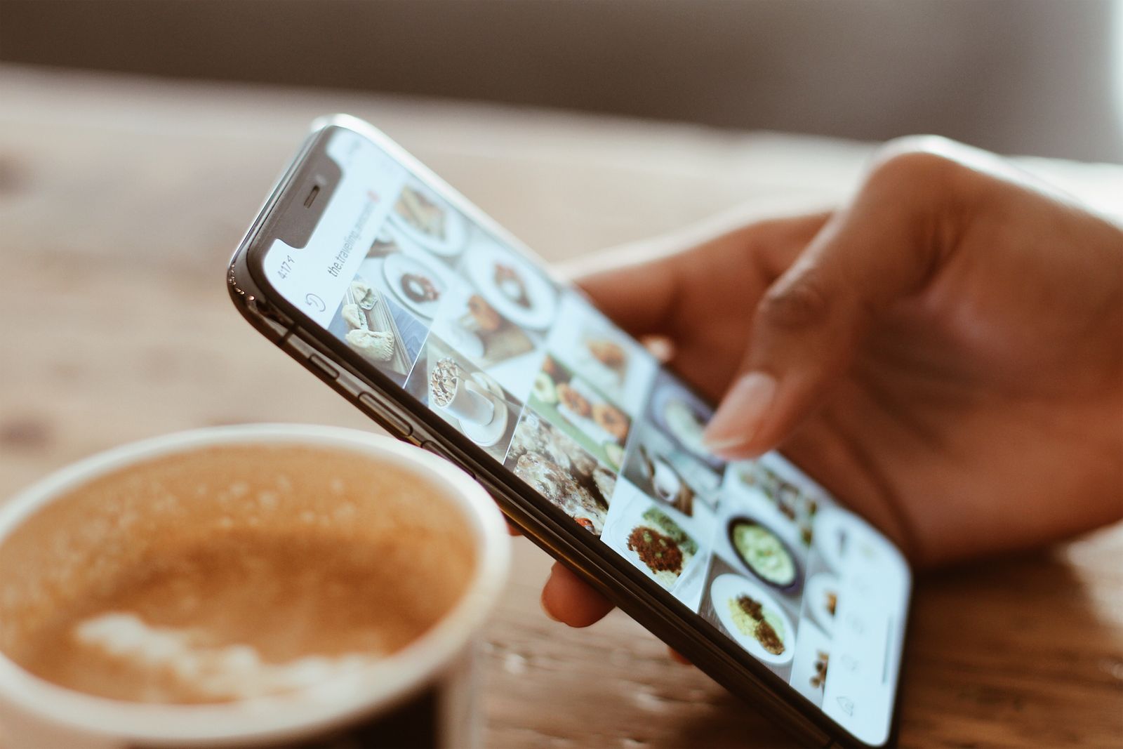 Person filming a vertical short-form video of a product with a smartphone