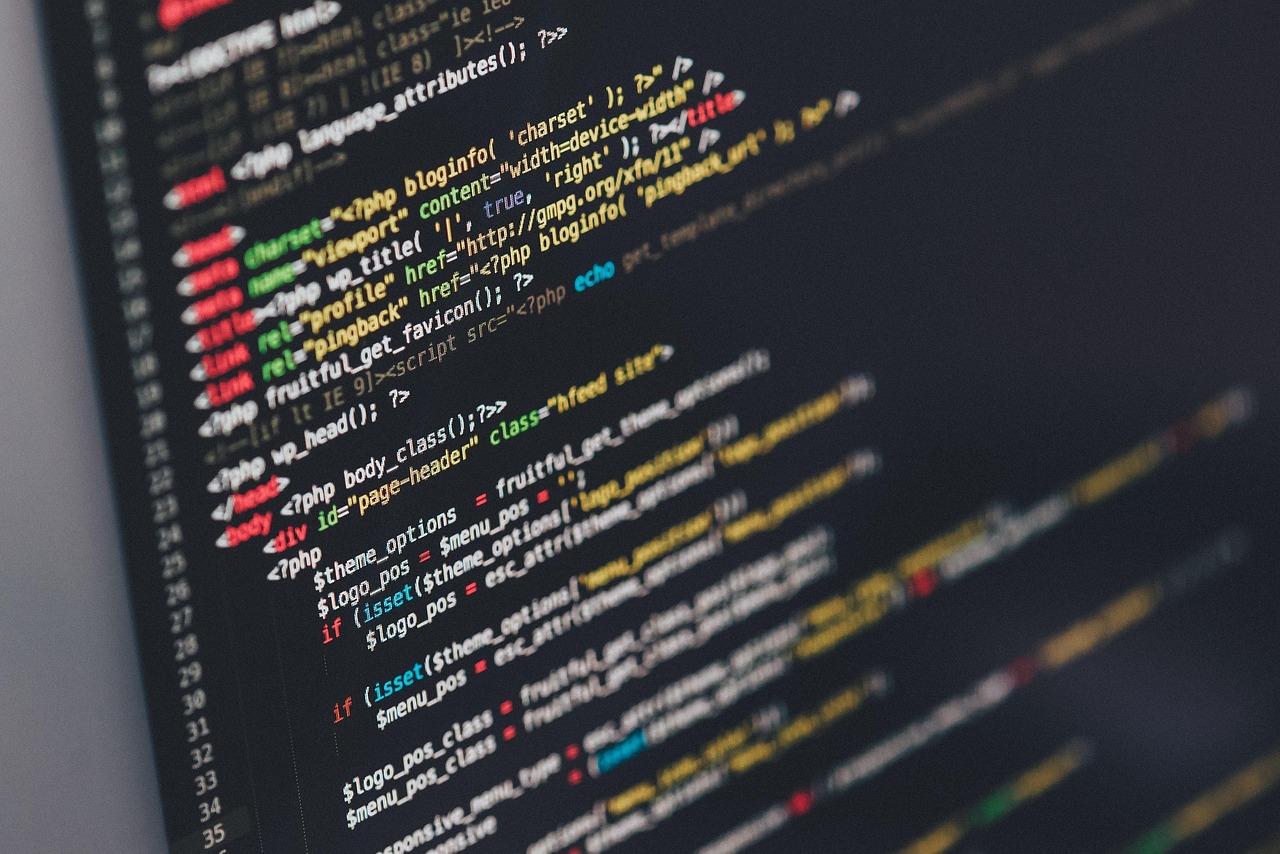 Designer working on a modern website layout on a laptop